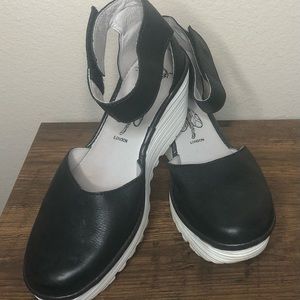Fly London Yand size 9 (EU 40) black leather ankle strap wedge shoe.